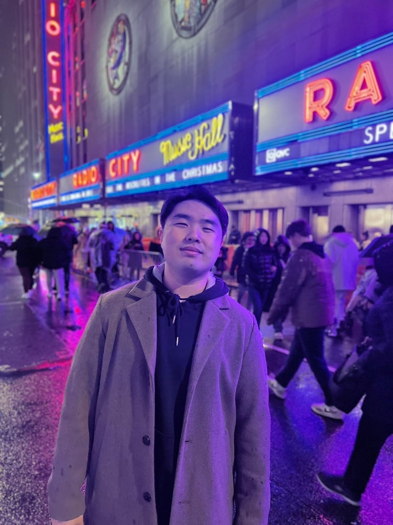 Chris outside Radio City Music Hall at night