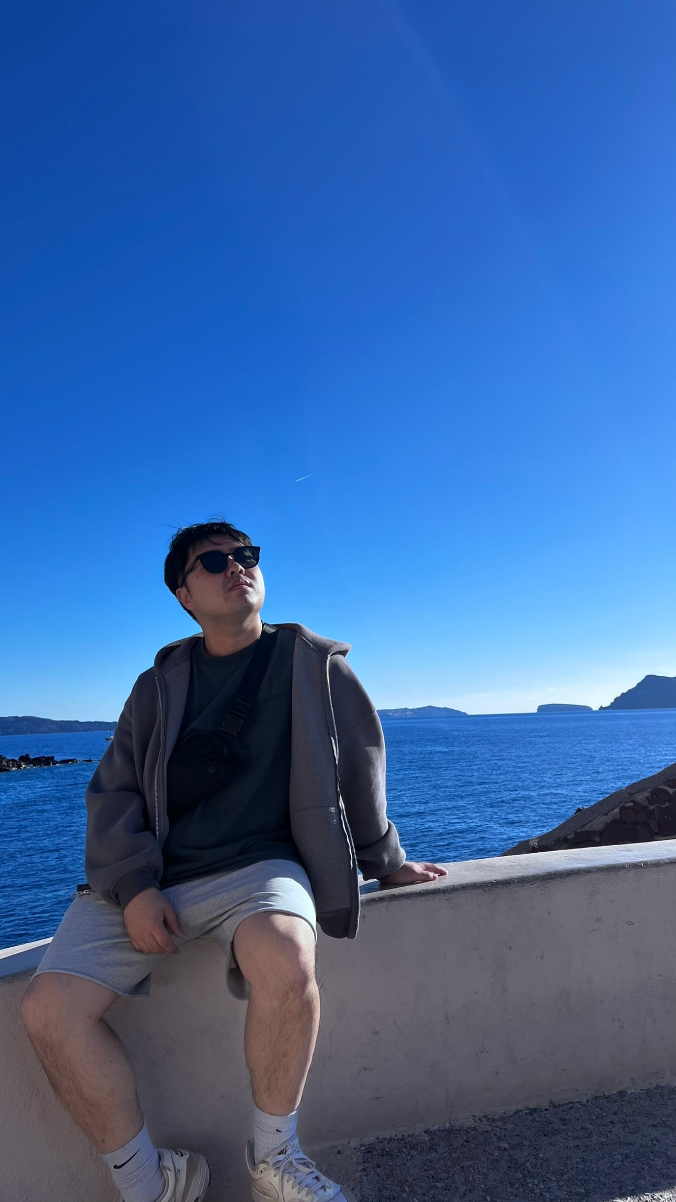 Chris seated by the sea